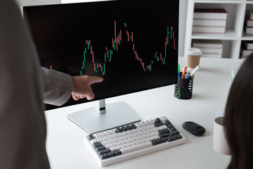 Aufkleber - Close up view of young business team analyzing the stock market trend, focusing on computer monitor.
