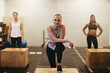 © Flamingo Images - Fit young woman ready for a gym box jump workout