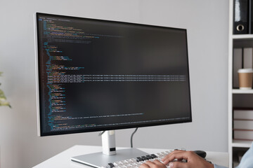 Poster - Close up view of programmer making software developer programming code with desktop computer in the office room.