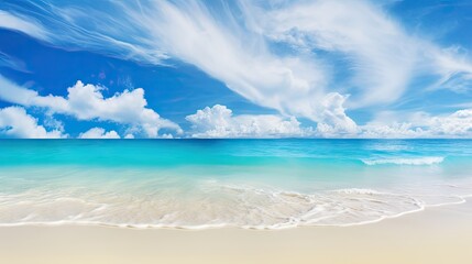 Beautiful sandy beach with white sand and rolling calm wave of turquoise ocean on Sunny day on background white clouds in blue sky.