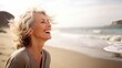 © Adriana - Laughing attractive mature senior woman looking away in the coast