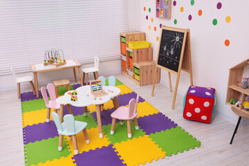 Wall Mural - Stylish kindergarten interior with toys and modern furniture