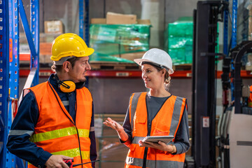 Wall Mural - Caucasian man and woman industrial worker work in manufacturing plant. 