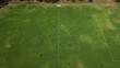 Aerial establishing shot showing start of soccer match during beautiful sunny weather in Australia - Drone tilt down