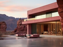 One modern pink building in the middle of the desert and mountains