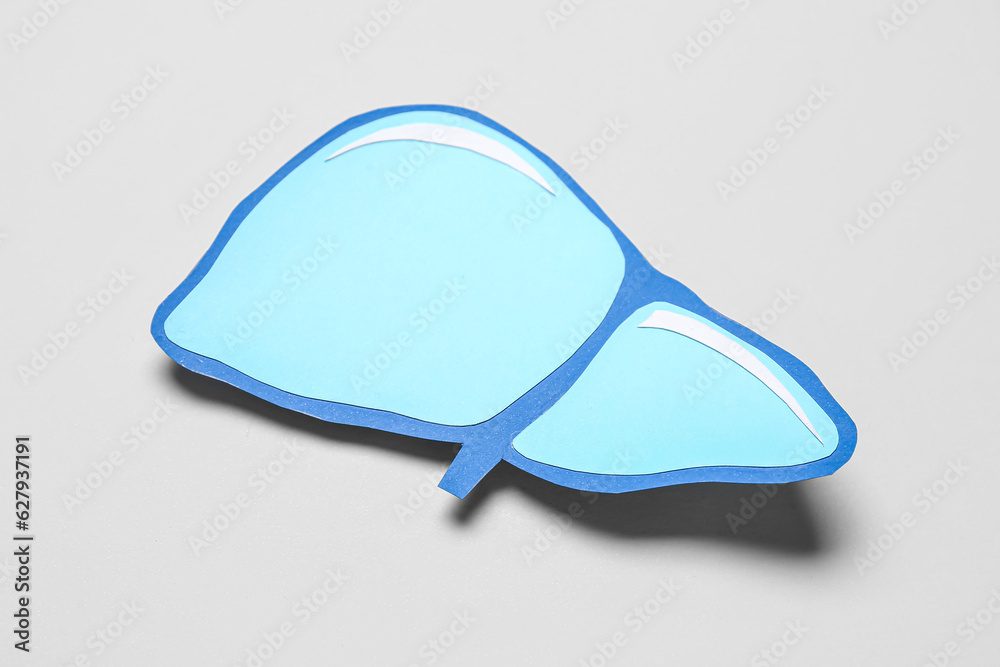 Blue paper liver on grey background