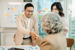 © Nuttapong punna - Two confident business man shaking hands during a meeting in the office, success, dealing, greeting and partner