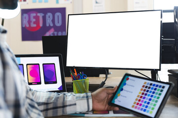 Fototapete - Midsection of indian male designer using tablet and computer with copy space at desk in office