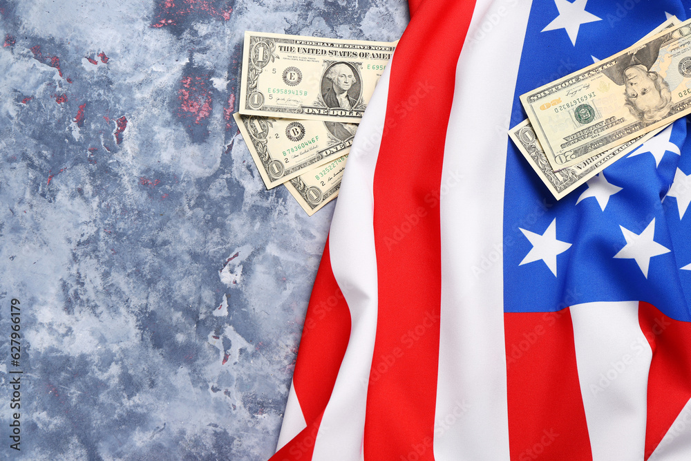 Flag of USA and dollar banknotes on blue background
