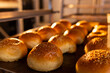 © Wavebreak Media - Close up of baking tray with fresh rolls with seeds in bakery kitchen, copy space