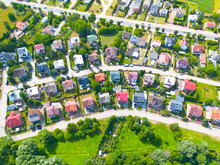 Aerial View Of Residential Houses At Spring.  Neighborhood, Suburb. Real Estate, Drone Shots, Sunset, Sunlight, From Above.
