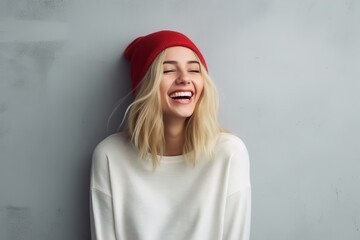 portrait of young happy smiling woman wearing hat