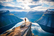 Leinwandbild Motiv Unraveling Norway's Natural Beauty: Witnessing the Magnificence of Trolltunga's Majestic Mountain Landscape
