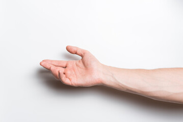 Wall Mural - Close-up of a man's hand stretched palm up on a white background.