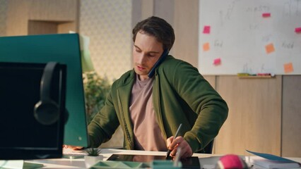 Wall Mural - Busy artist talk phone at workplace closeup. Web designer drawing graphic tablet