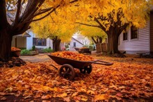 Autumn Yard With Wheelbarrow Full Of Fallen Leaves