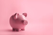 Piggy bank on a pink background with copy space. Finance, business, budgeting, economics. World crisis, economical regress, depression. Money saving, budget, financial advice 