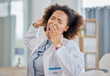 Tired doctor, woman and yawn in hospital with burnout, medical stress and working with low energy in clinic. Fatigue of black female healthcare worker yawning while feeling overworked, sleepy or lazy