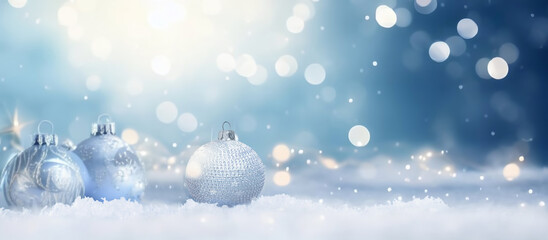 Poster - Beautiful Christmas decoration with light blue Baubles on the snow against a backdrop of sparkling lights in the evening.
