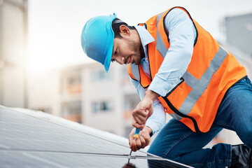 Wall Mural - Solar panels, tool and male engineer on a rooftop doing maintenance or repairs with screwdriver. Renovation, handyman and zoom of an industrial worker working on eco friendly construction on building