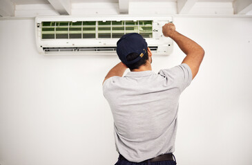 Poster - Maintenance, air conditioning technician and man from back working on ventilation filter for ac repair. Contractor, handyman or electric aircon machine expert problem solving, electrician with tools.