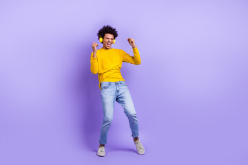 Poster - Full body photo of cheerful carefree person ecstatic listen music headphones dance empty space isolated on violet color background