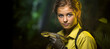 Exciting young snake handler, confidently holding reptile in soft-focus jungle backdrop. Extra space on the side for diverse application. Generative AI