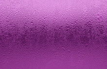 Closeup Of Condensation Texture On A Chilled Purple Glass Bottle