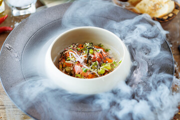 Wall Mural - Tuna tartare. Ponzu sauce, chives, cucumber, masago and nori. Delicious healthy Italian traditional food closeup served for lunch in modern gourmet cuisine restaurant