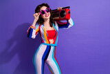 Photo of funky cool lady wear striped overall listening boom box discotheque songs empty space isolated purple color background