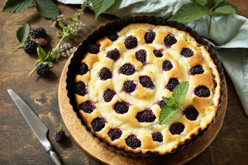 Canvas Print - Sweet pie with blackberry and custard on wooden table. Homemade blackberry pie. Vegan gluten-free pastry, vegan desserts.