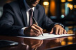 © Gonzalo - Close up of businessman signing a contract.