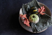 Autumnal Table Setting Against Dark Background