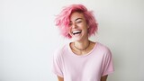 Fototapeta  - young laughing woman with pastel pink hair, tongue sticking out, blue eyes, peace gestures funny facial expressions