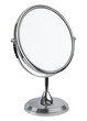 © artiom.photo - Round mirror for makeup. Magnifying mirror with 360° rotating. Cosmetic, cosmetology or makeup desk mirror. Silver metal stand magnify mirror for beauty salon. Woman skincare bathroom accessories
