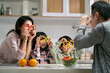 © imtmphoto - young asian family with two children having a good time in kitchen at home