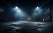 © MUS_GRAPHIC - An empty studio with a cement floor, with floodlights above and smoke in the background