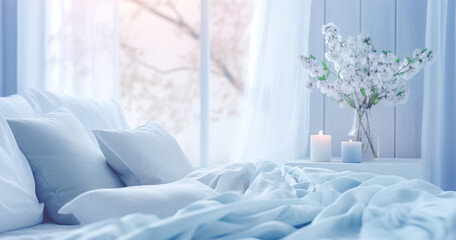 Cozy light blue Bedroom with flowers and candles. pillows, duvet and duvet case on a bed. Blue bed linen on a blue sofa. Bedroom with bed and bedding. Blurred view of light bedroom with big window, ai
