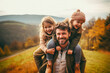 © mila103 - Happy family of three having fun in autumn nature. Father, mother and daughters