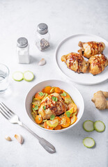 Wall Mural - Moroccan spiced chicken with zucchini and carrots in a plate