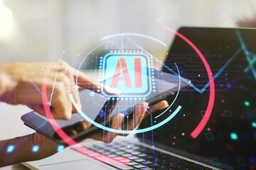 Aufkleber - Double exposure of creative artificial Intelligence abbreviation and hand working with a digital tablet on background. Future technology and AI concept
