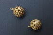 © Rystemys - Brass round bells on a black background. Decorations or jewelry for people and animals.