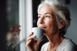 cropped shot of an attractive senior woman drinking coffee