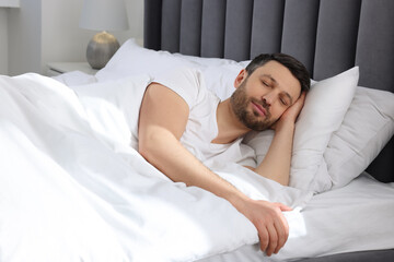 Sticker - Handsome man sleeping in soft bed at home