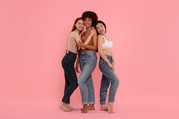 Portrait of beautiful young women on pink background