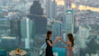 Asian woman friends celebrating dinner party together at skyscraper rooftop restaurant bar in the city at summer sunset. Attractive girl enjoy urban outdoor lifestyle nightlife on holiday vacation.