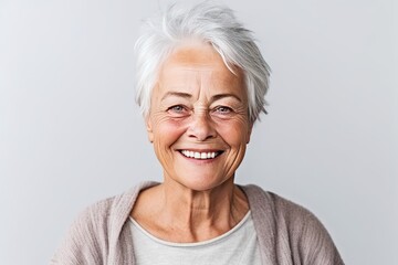 An older woman with white hair smiling