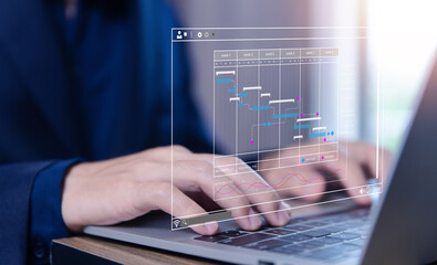 Fototapete - business manager managing business planning project schedules in the office. Gantt chart showing on virtual screen.	
