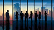 © Sasint - Silhouette of Business People Posing by Windows