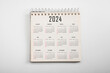 © Celt Studio - Calendar Year 2024 schedule on paper background. Flat lay with calendar. 12 months desk calendar 2024 Calendar desk 2024 on white background